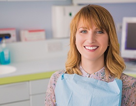 Red-haired female patient in dental chair